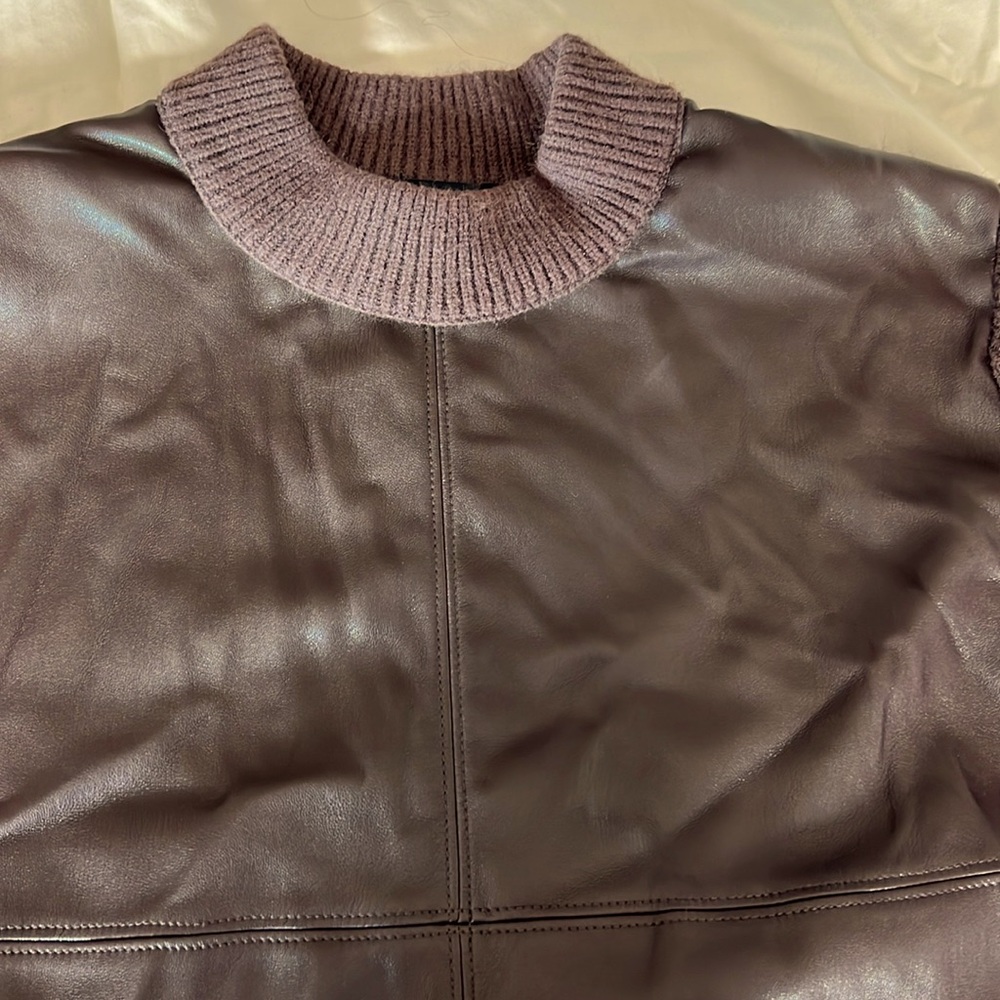 Chocolate brown sweater front is synthetic leather